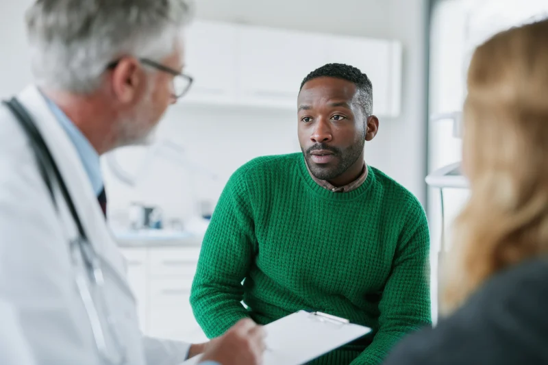 Doctor consulting with patient in a clinic office