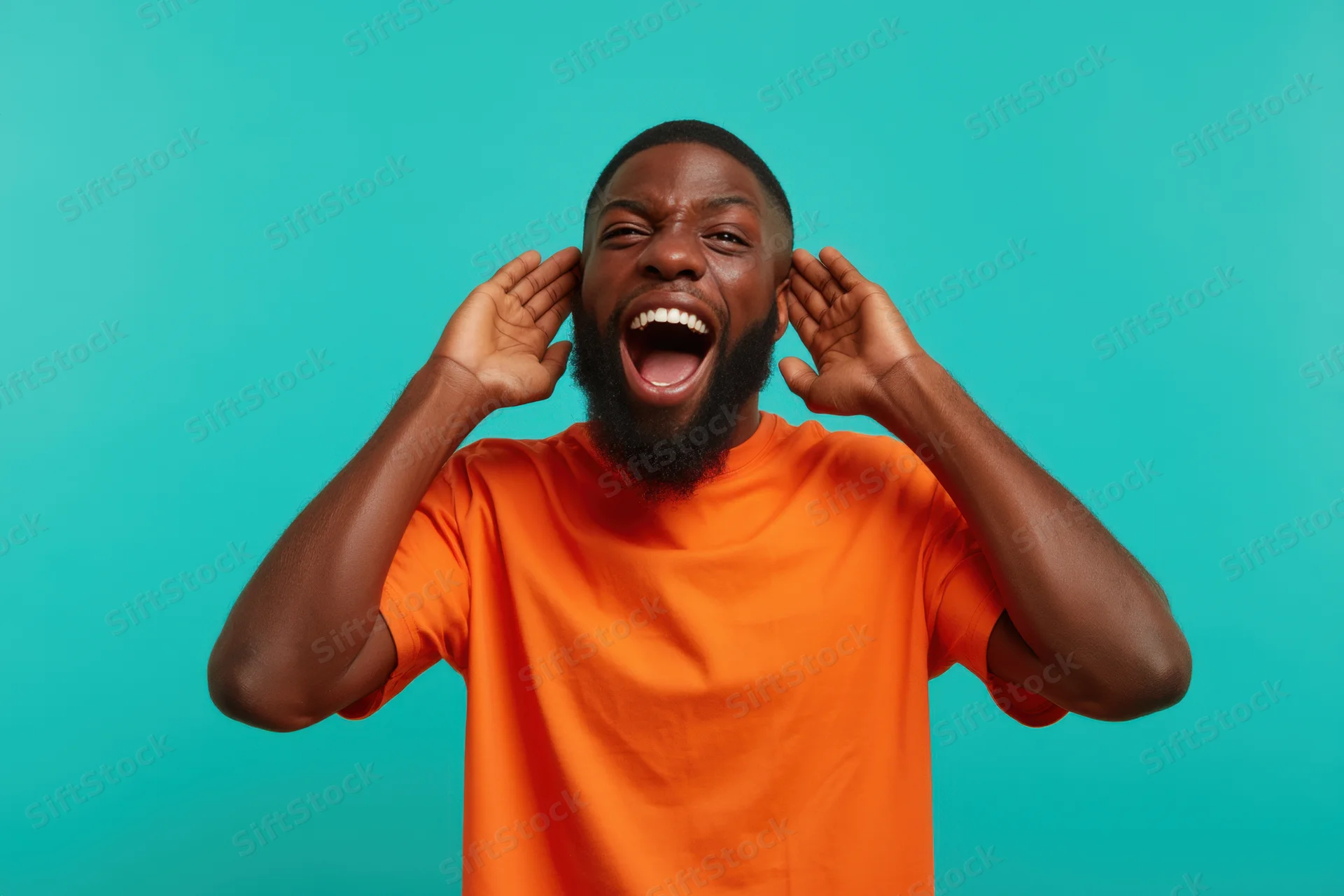 Man shouting with hands on ears in orange t-shirt against turquoise background