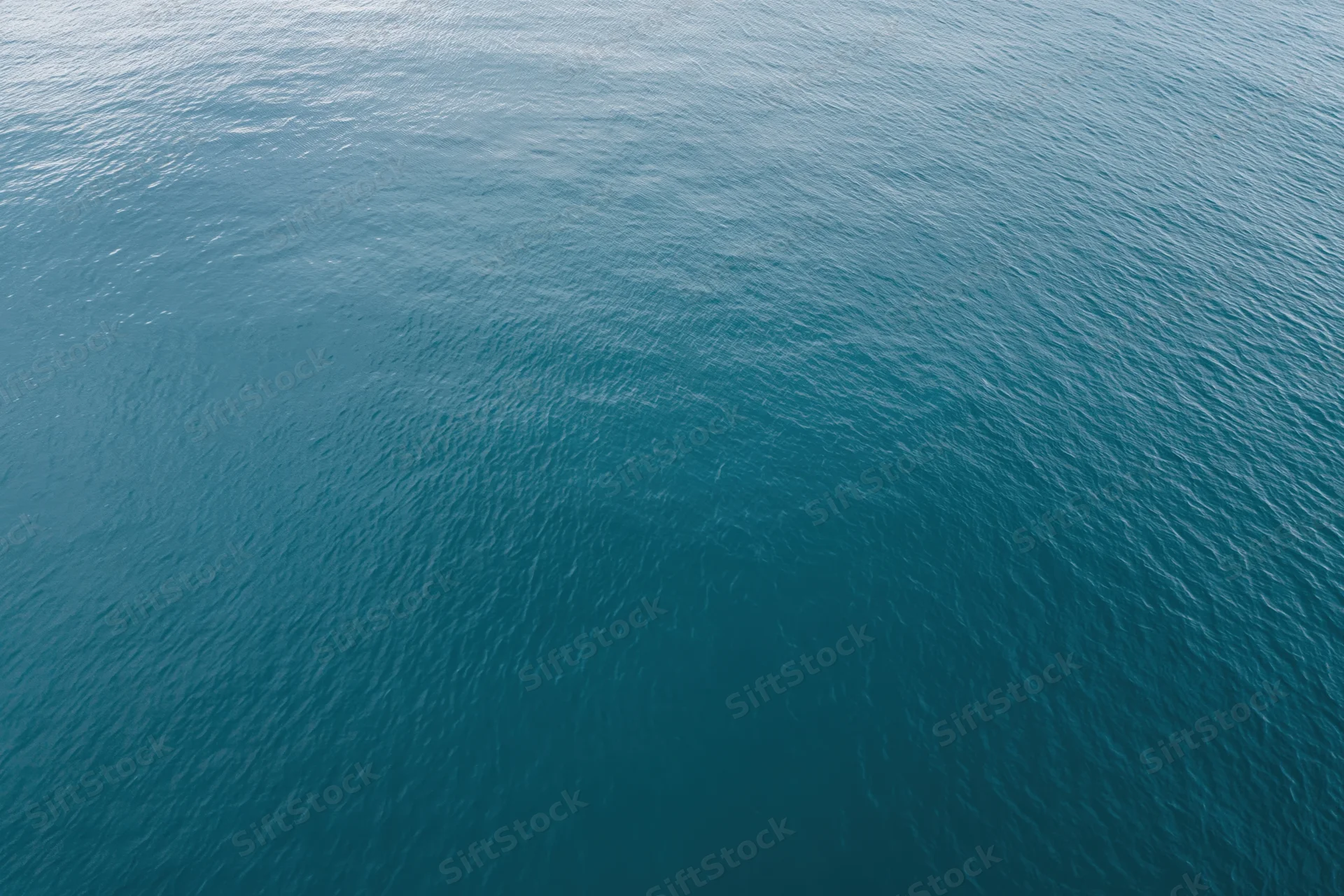Aerial top-down view of calm open water filling the frame
