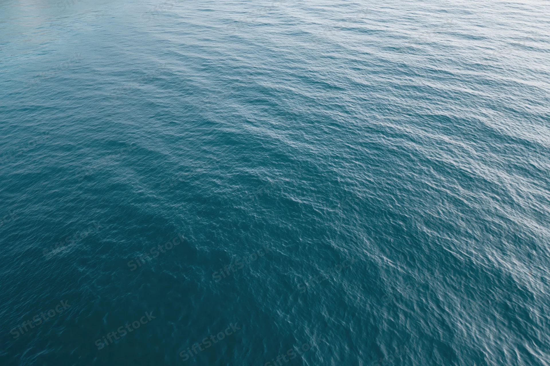 Aerial top-down view of calm open water filling the frame