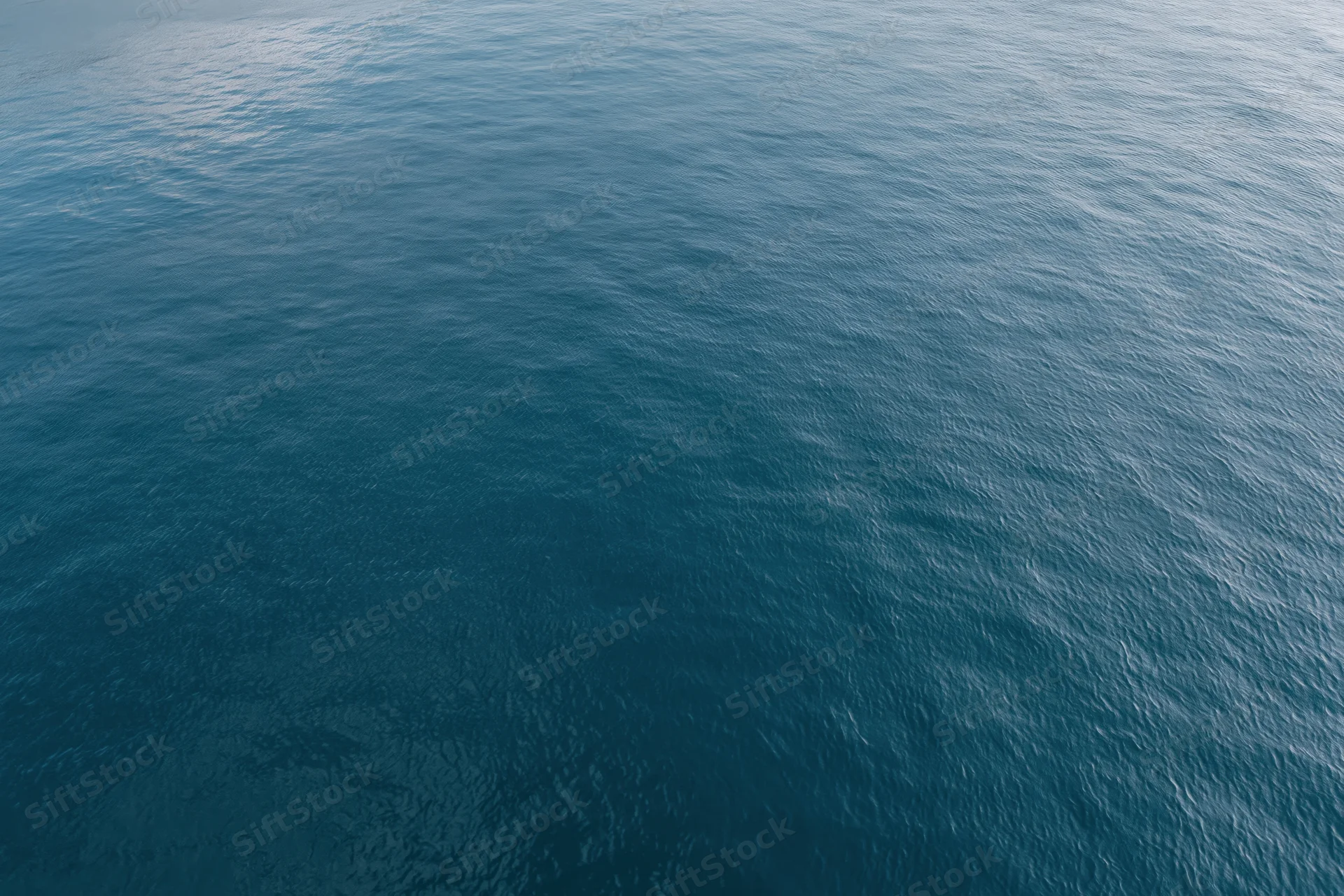 Aerial top-down view of calm open water surface