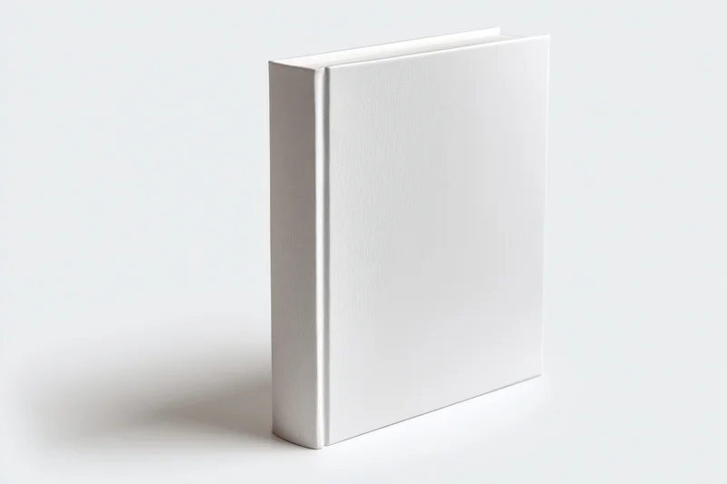 Blank white hardcover book standing upright on a plain white surface