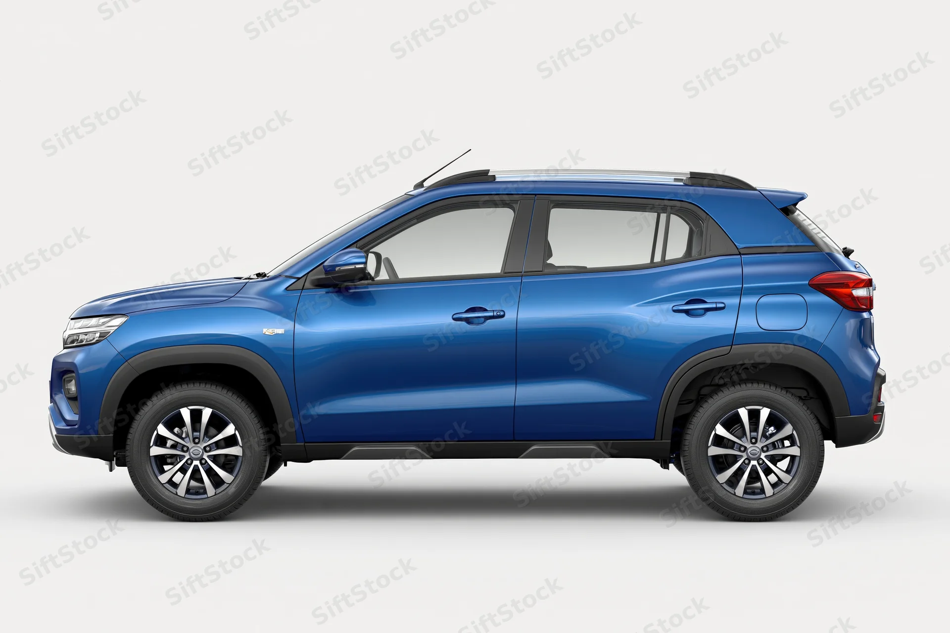 Blue compact suv in side profile view against white background