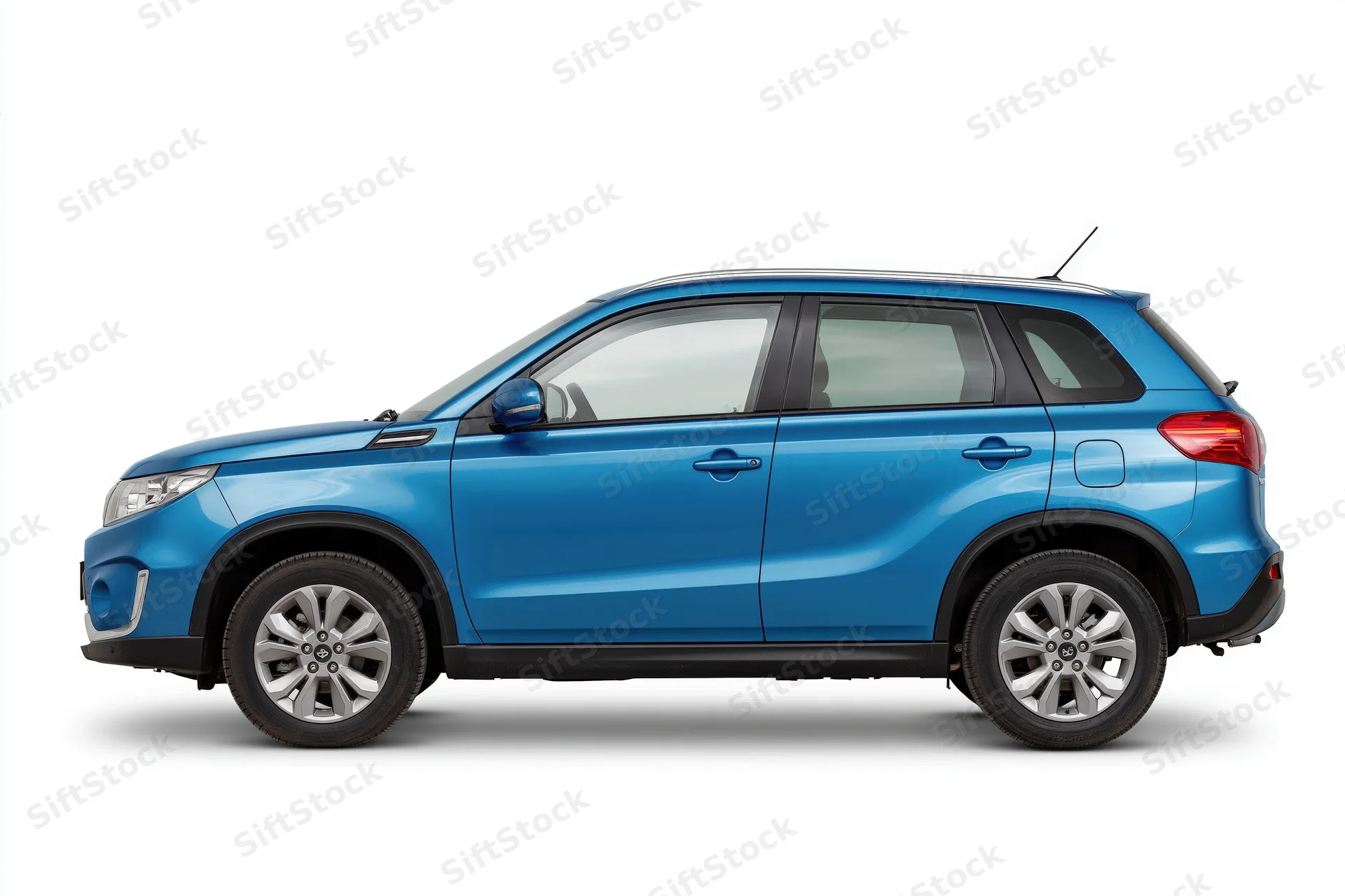 Blue compact suv in side profile view against white background
