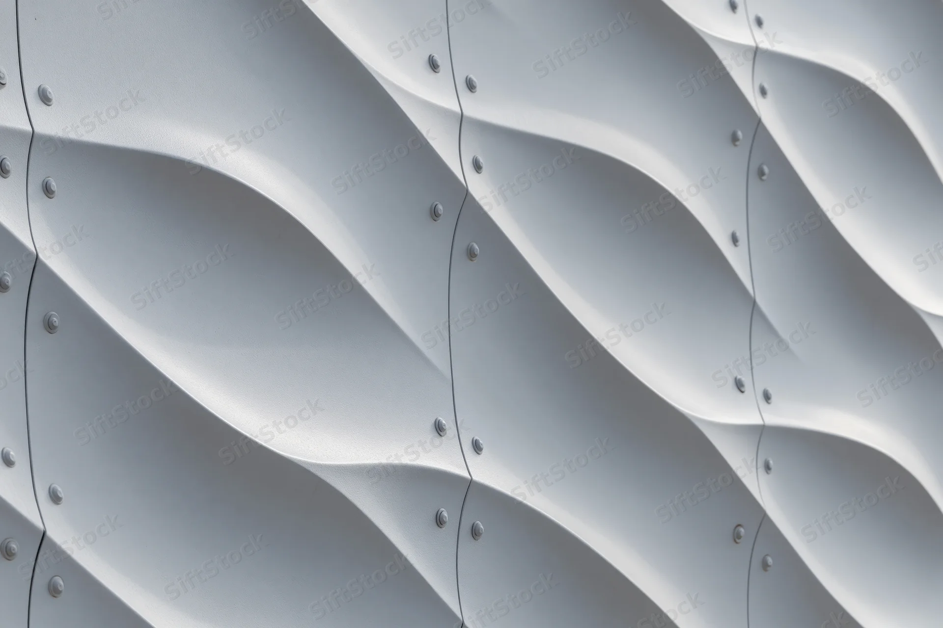 Close-up of wavy metal panels on a modern building facade
