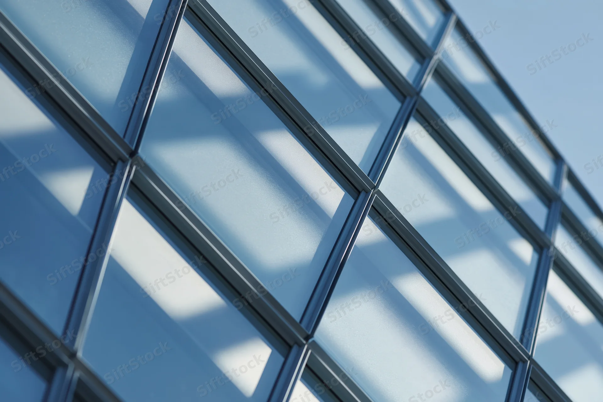 Close-up of a modern glass curtain wall facade on a building exterior