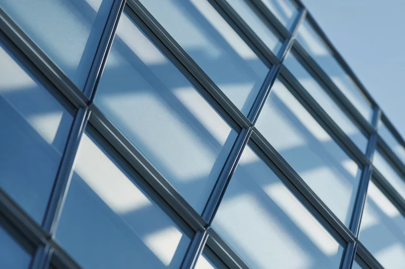 Close-up of a modern glass curtain wall facade on a building exterior