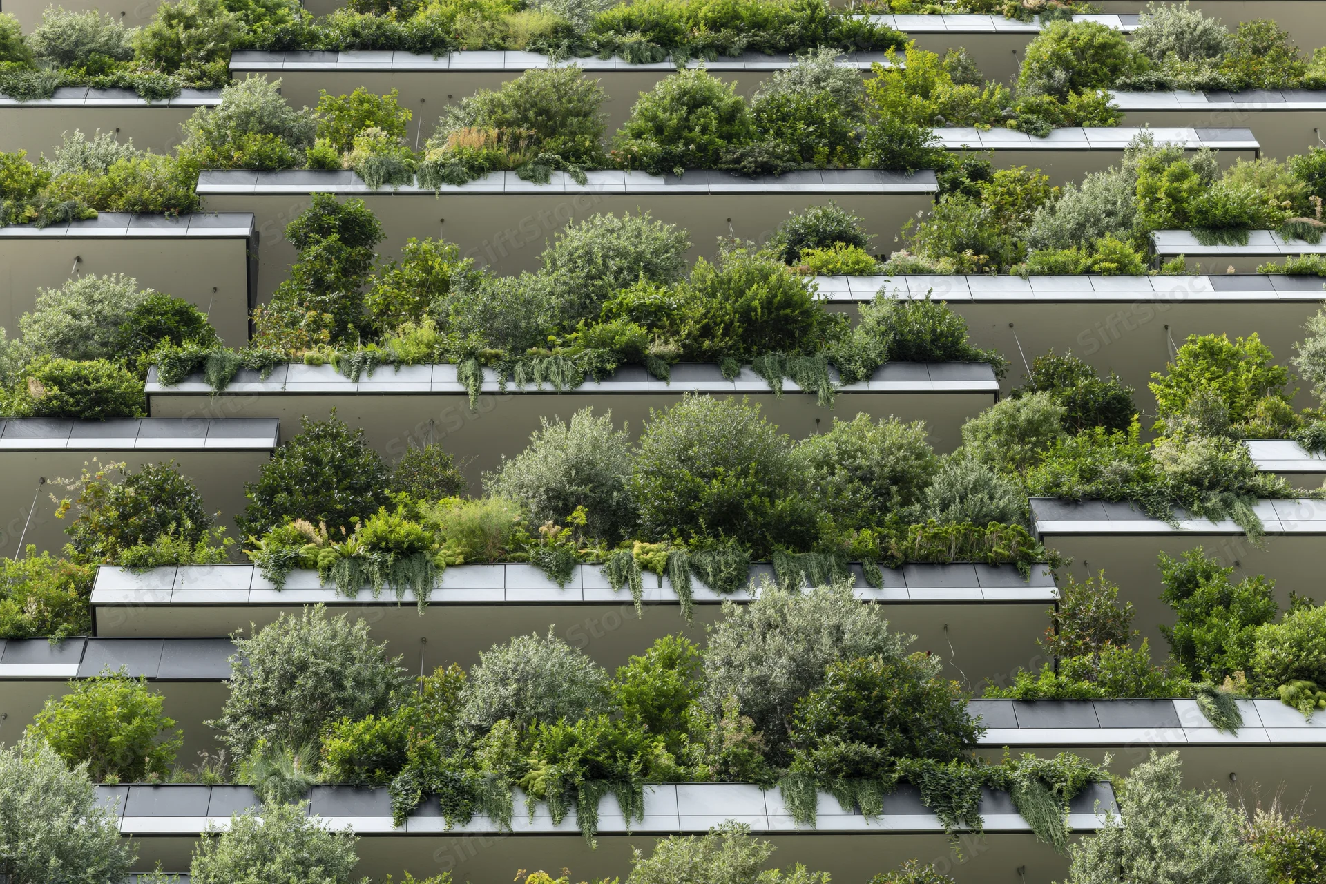 Tiered green wall on a modern residential building facade