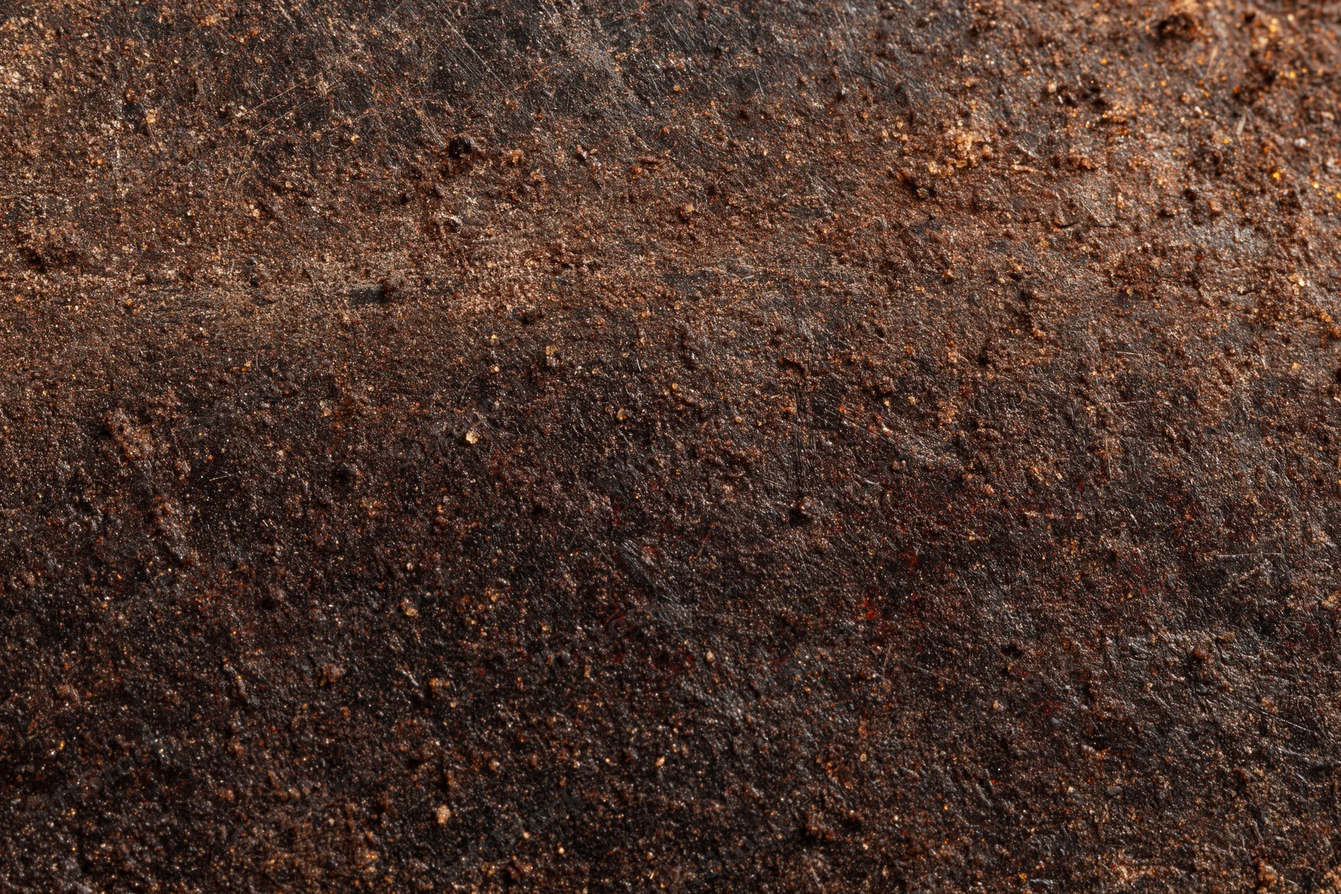 Close-up of a rusted metal surface showing aged texture and corrosion