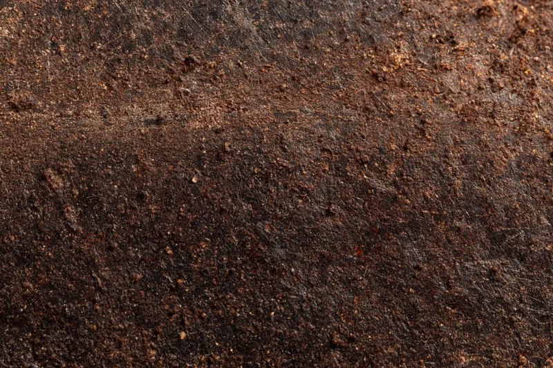 Close-up of a rusted metal surface showing aged texture and corrosion