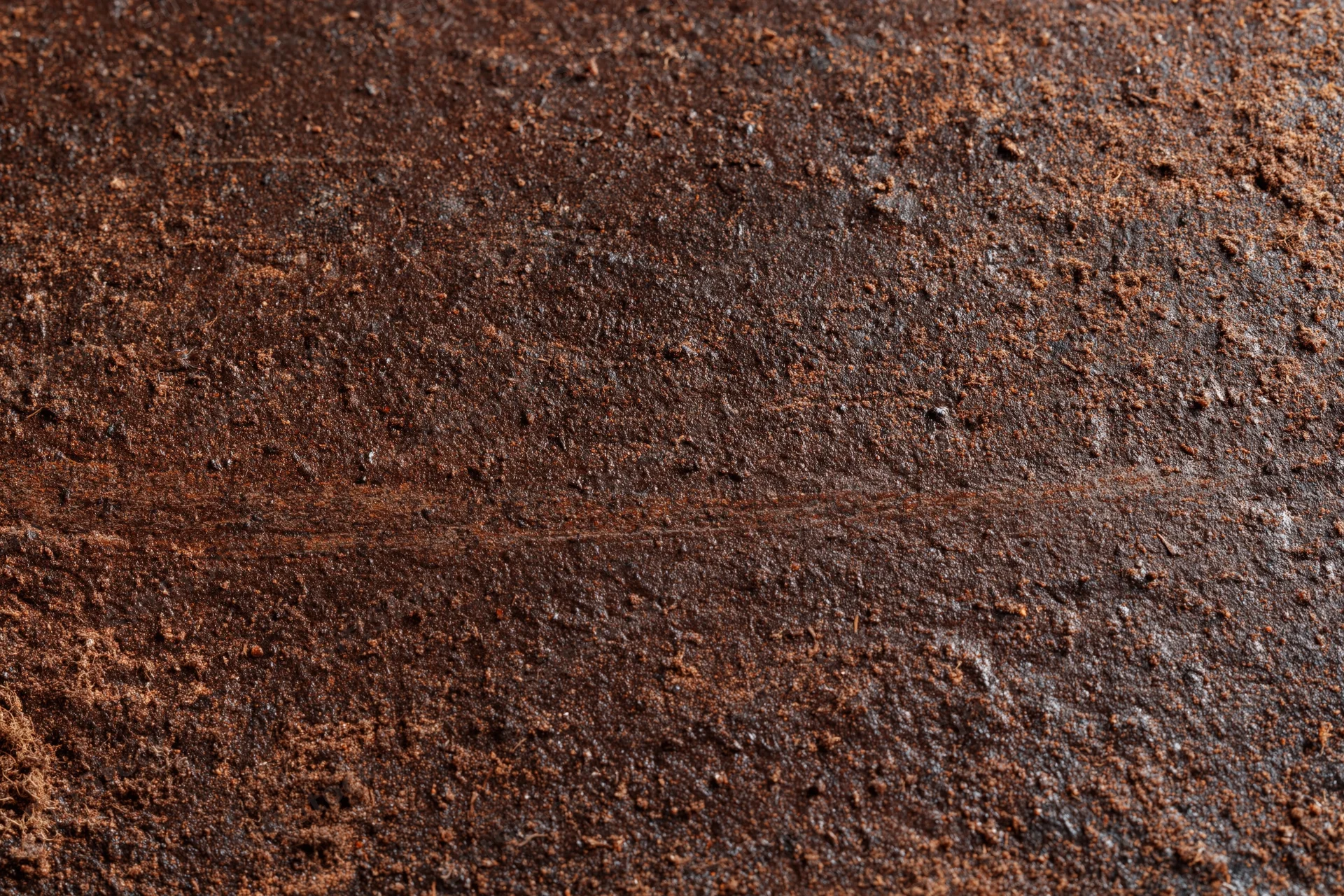 Close-up of a rusted metal surface showing weathered texture and corrosion