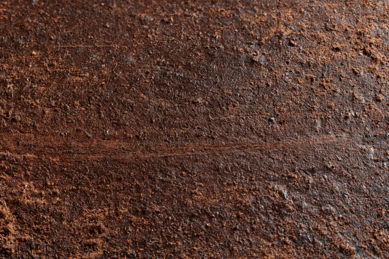 Close-up of a rusted metal surface showing weathered texture and corrosion
