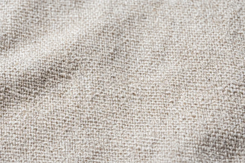 Close-up of natural linen fabric texture filling the frame