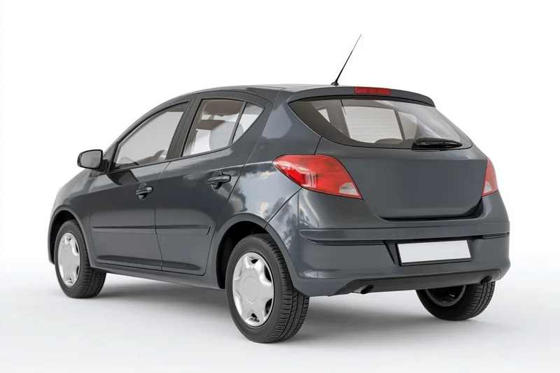 Dark grey compact hatchback viewed from rear in studio setting