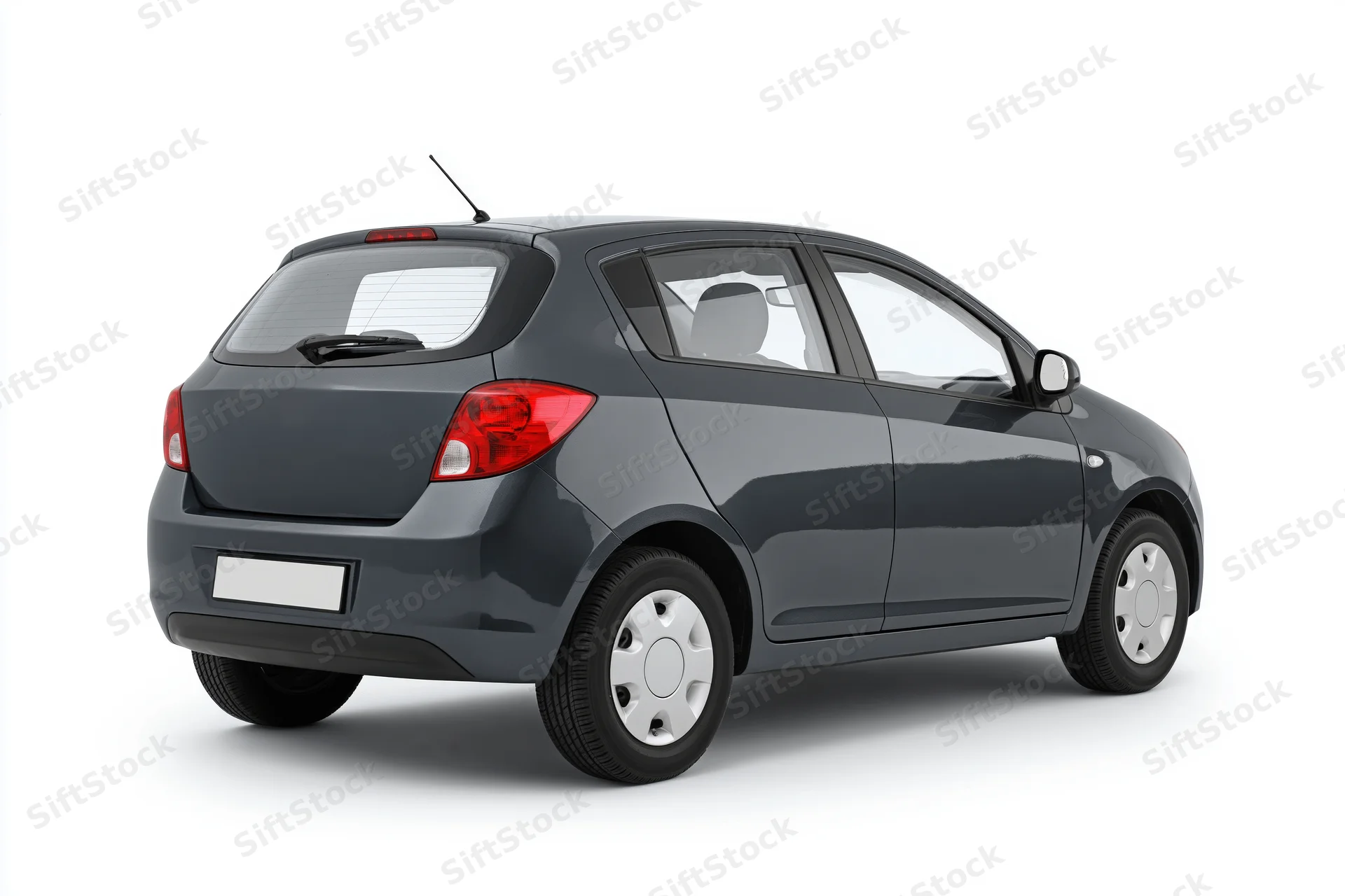 Dark grey compact hatchback viewed from rear on white background
