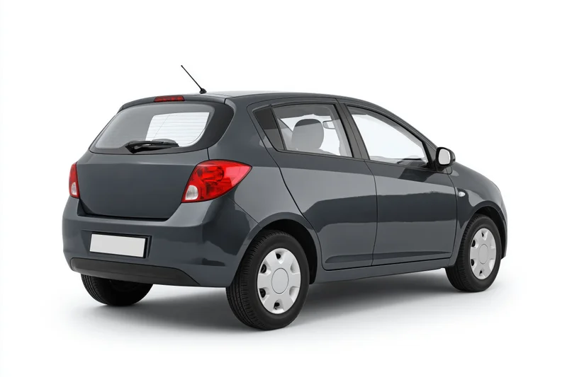 Dark grey compact hatchback viewed from rear on white background