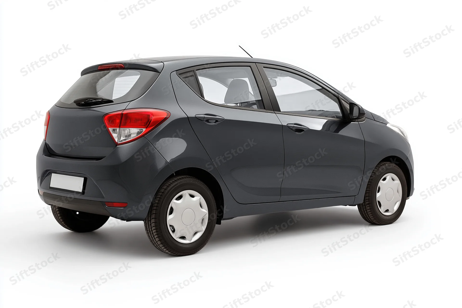 Dark grey compact hatchback viewed from rear three-quarter angle on white background