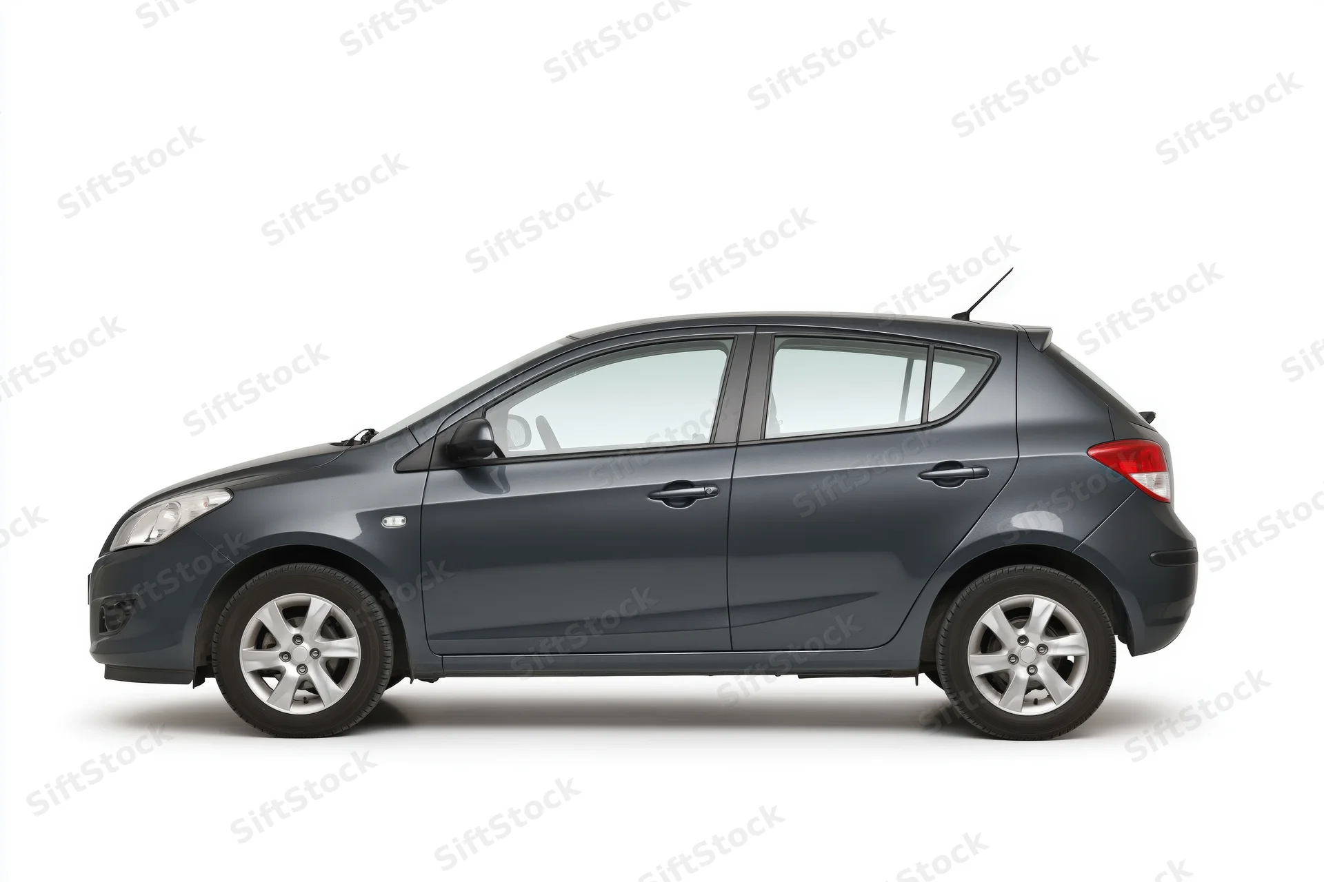Dark grey compact hatchback in side profile on white background