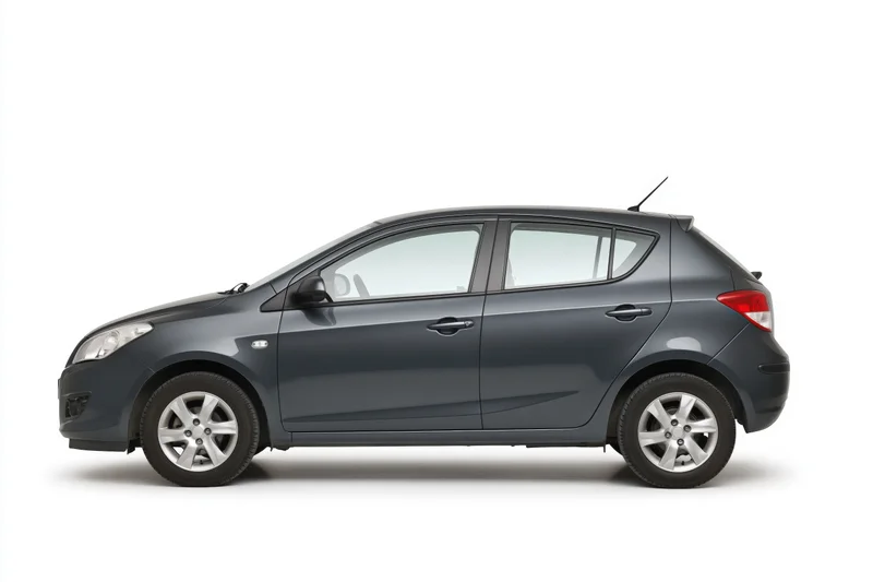 Dark grey compact hatchback in side profile on white background