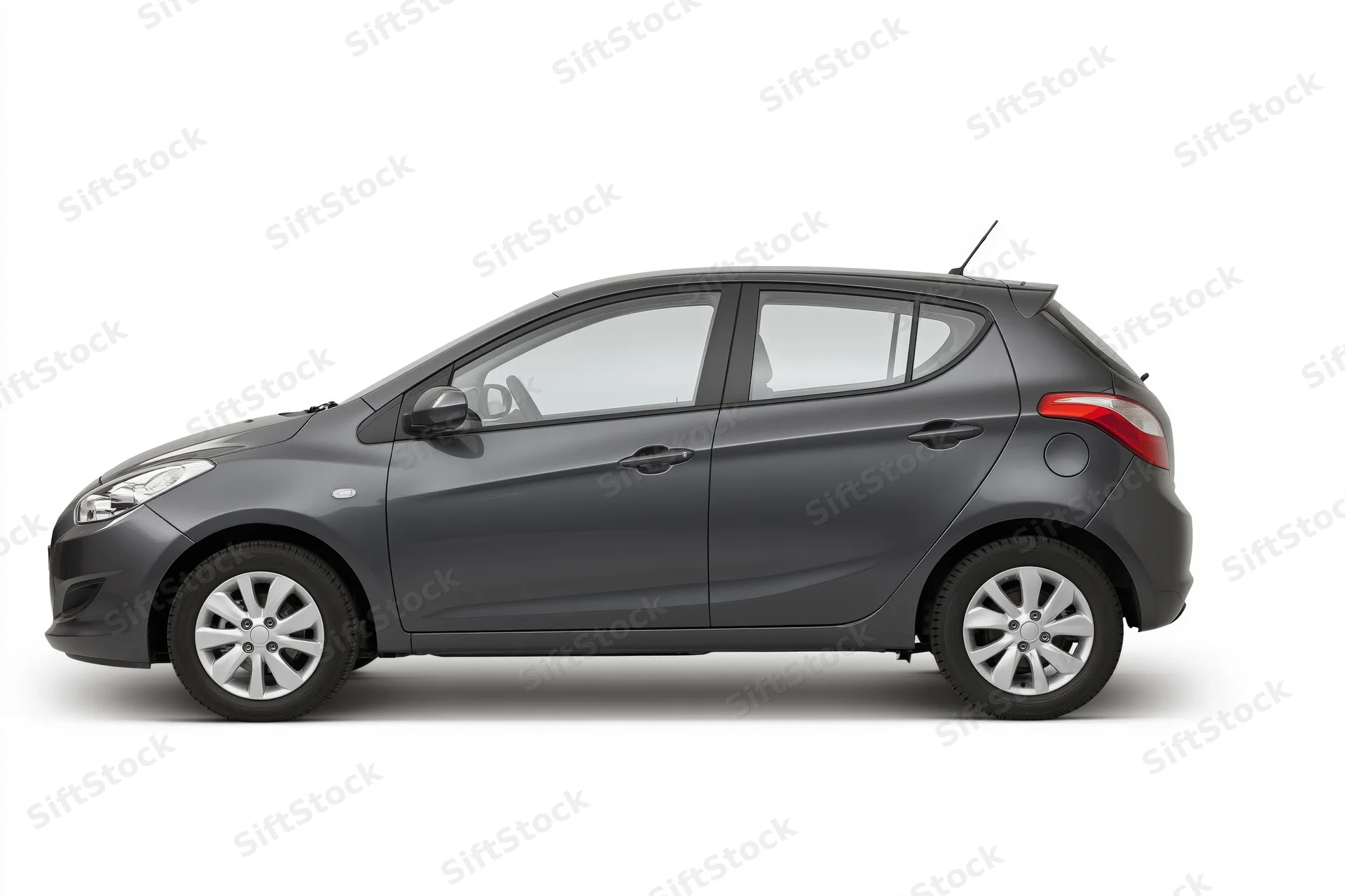 Dark grey compact hatchback in side profile on white background