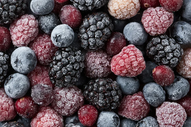 Frozen mixed berries densely packed in a close-up view