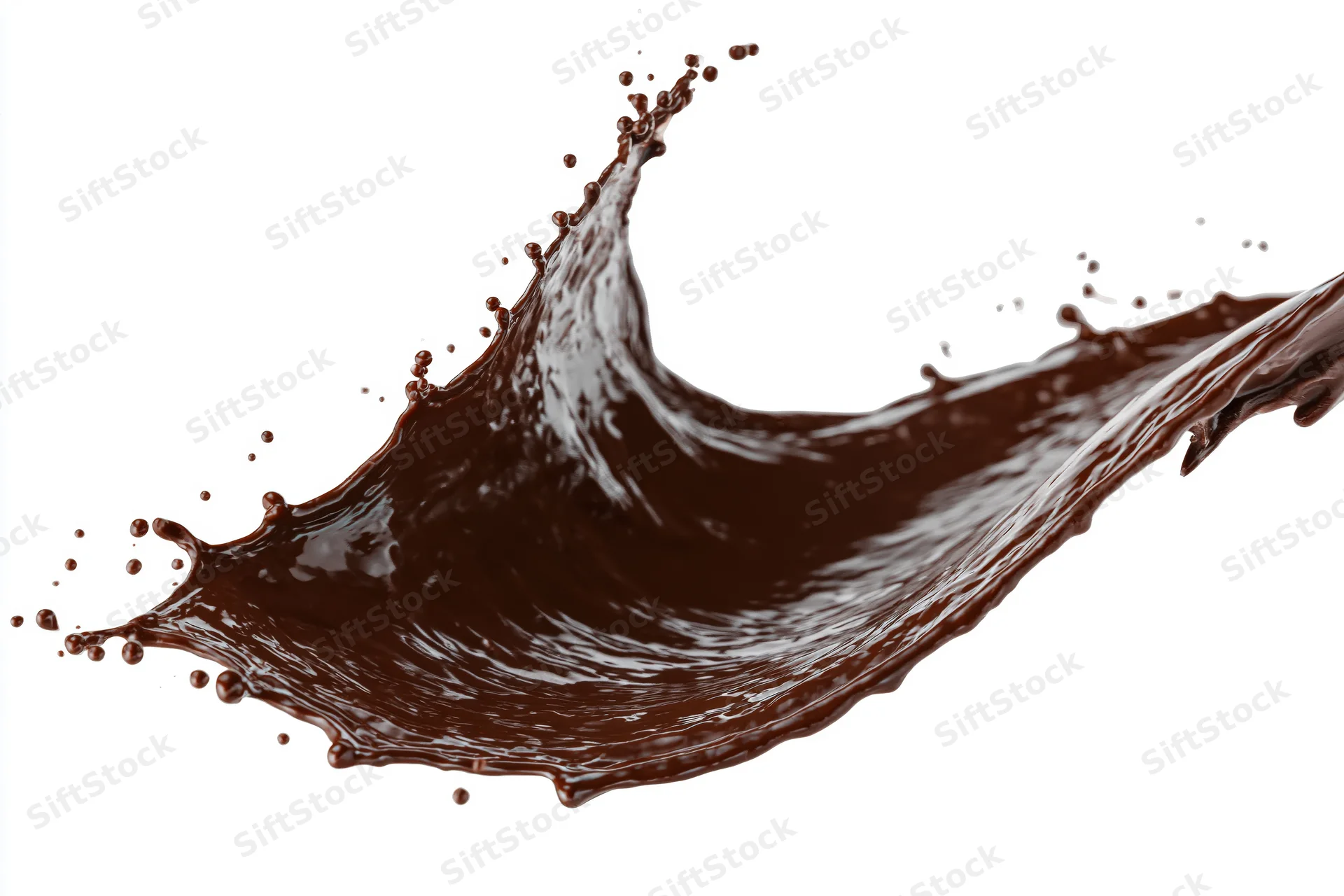 Dark chocolate liquid splashing in dynamic arc frozen midair against white background