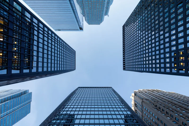 Low angle view of skyscrapers rising into the sky in a dense city center