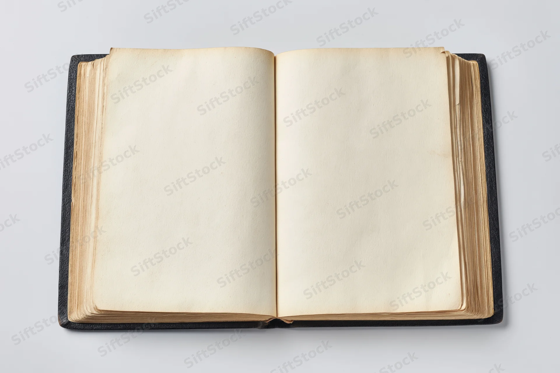 Open vintage hardcover book with blank cream pages on white background