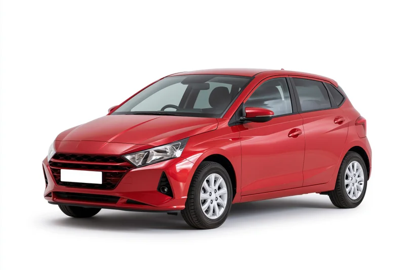 Red compact hatchback car in three-quarter front view on white background