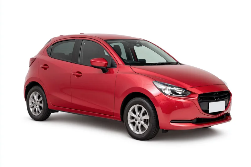 Red compact hatchback car in three-quarter front view on white background