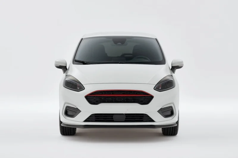 White compact hatchback front view in studio setting