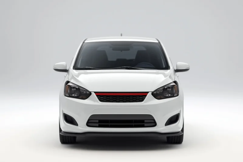White compact hatchback viewed straight-on from front in studio setting