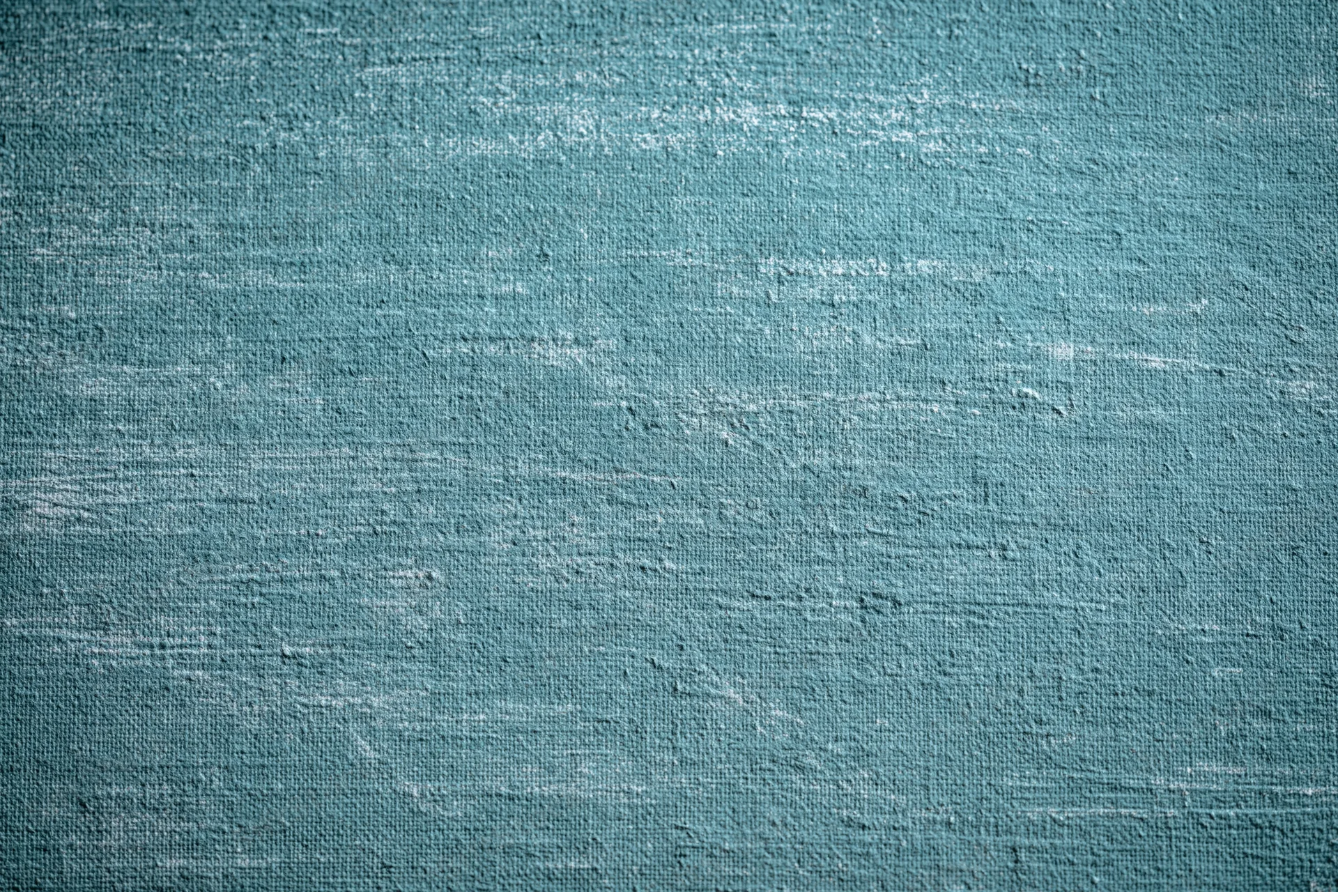 Worn teal-painted canvas texture filling the frame