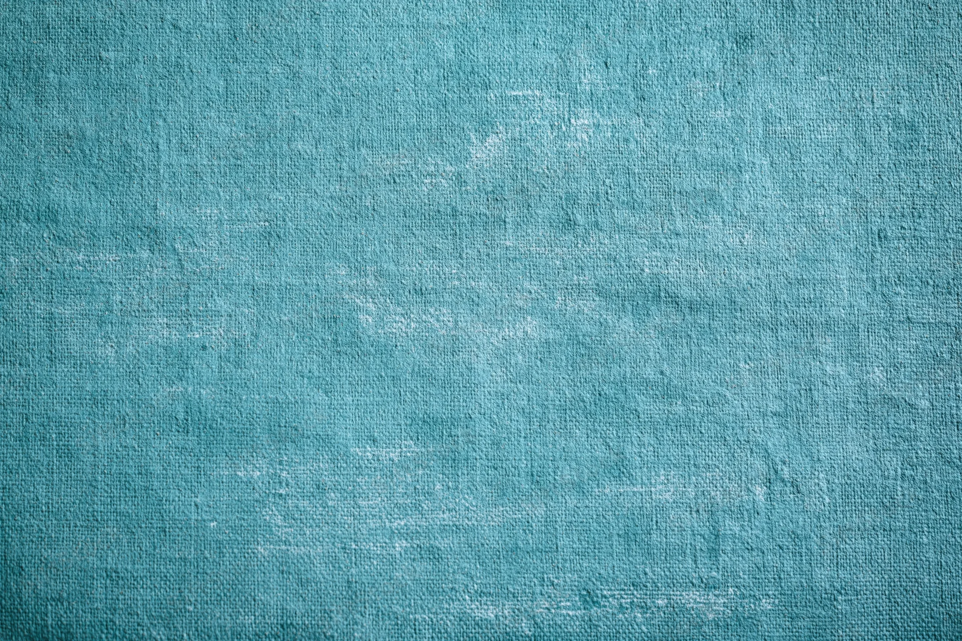 Teal painted canvas texture filling the frame