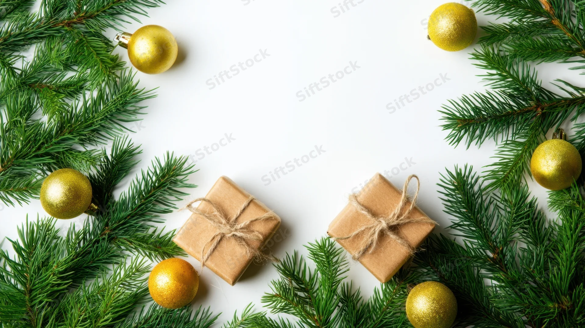 Christmas decorations and gifts arranged with pine branches on white background