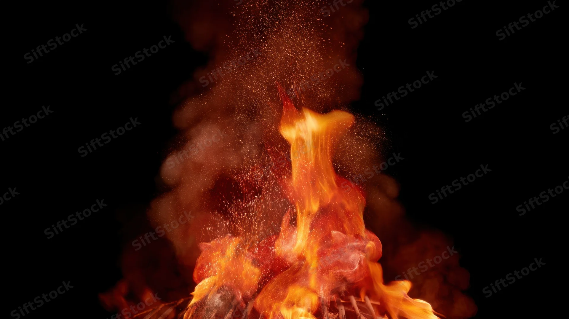 Intense flames and smoke rising against a black background