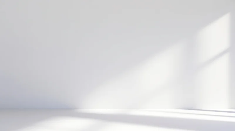 Empty white minimalist room with light and shadow on walls and floor