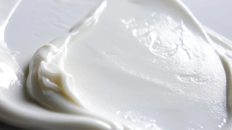 Smooth white cream spread on a plate, close-up view showing texture and sheen