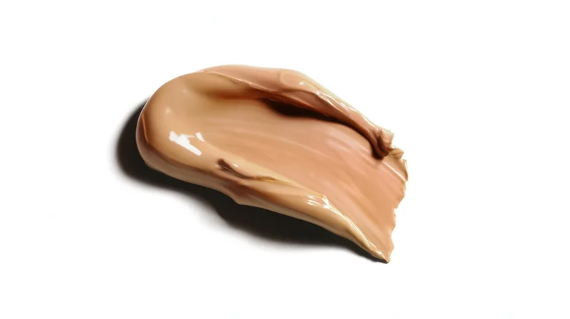 Smooth beige foundation cream swatch on white background