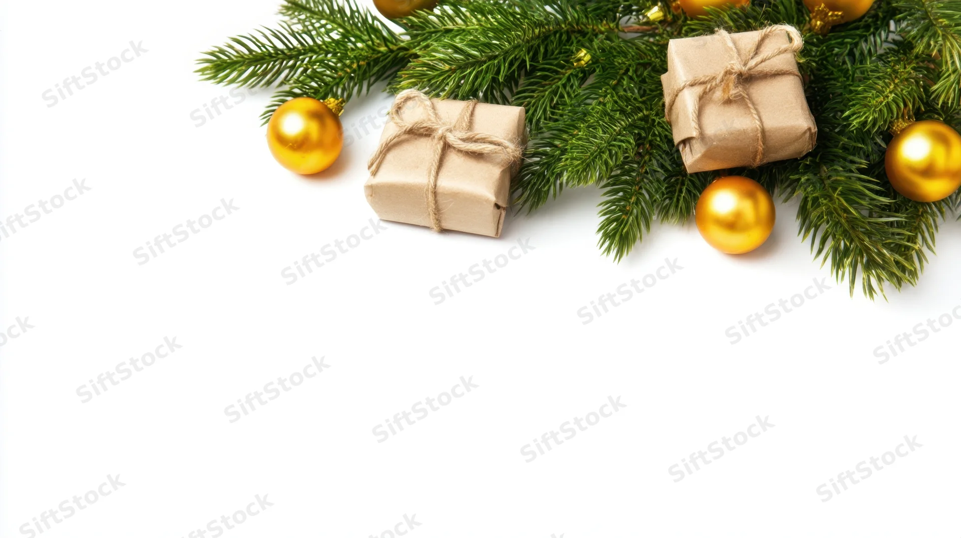 Christmas decorations and wrapped gifts arranged on white surface with copyspace