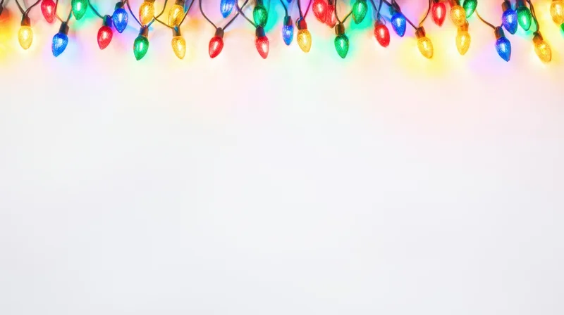 Christmas Lights Lined Across a White Background for Festive Holiday Decoration