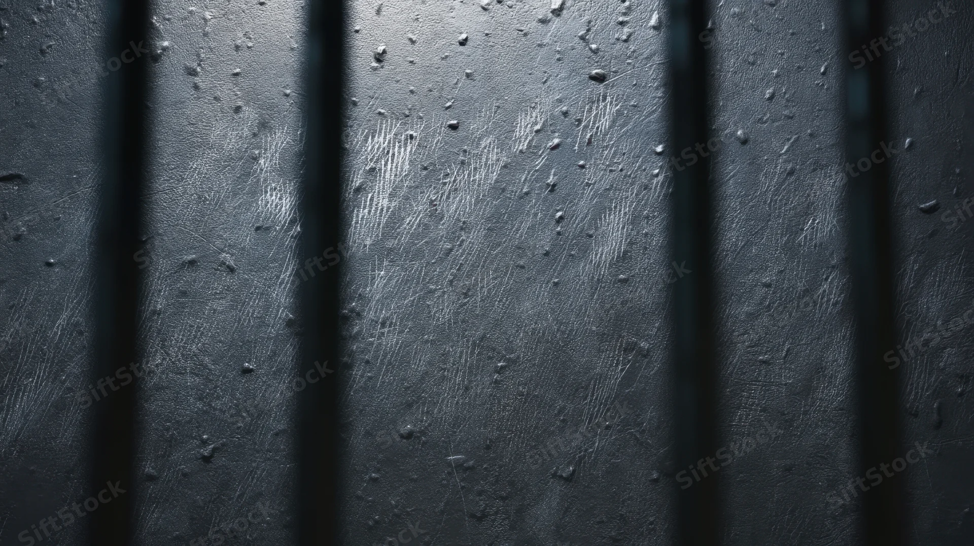 Dark textured metal surface with water droplets and vertical bars