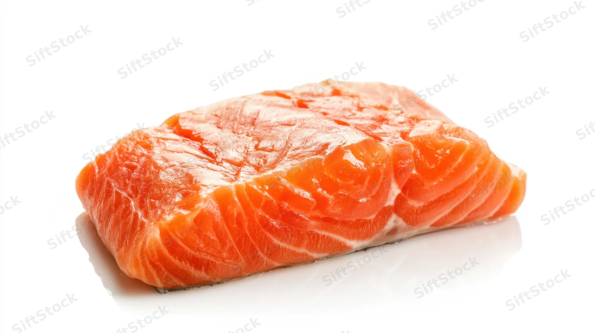 Raw salmon fillet on white background with reflection