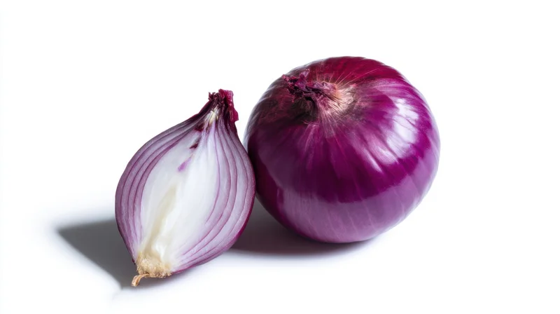 Whole and halved red onion on white background