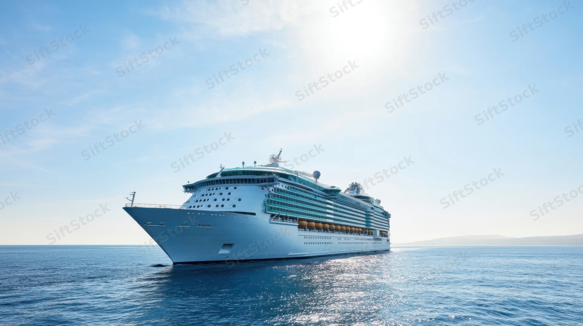 Large cruise ship sailing on calm blue ocean under clear sky