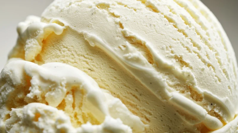Closeup of a smooth scoop of vanilla ice cream with creamy texture