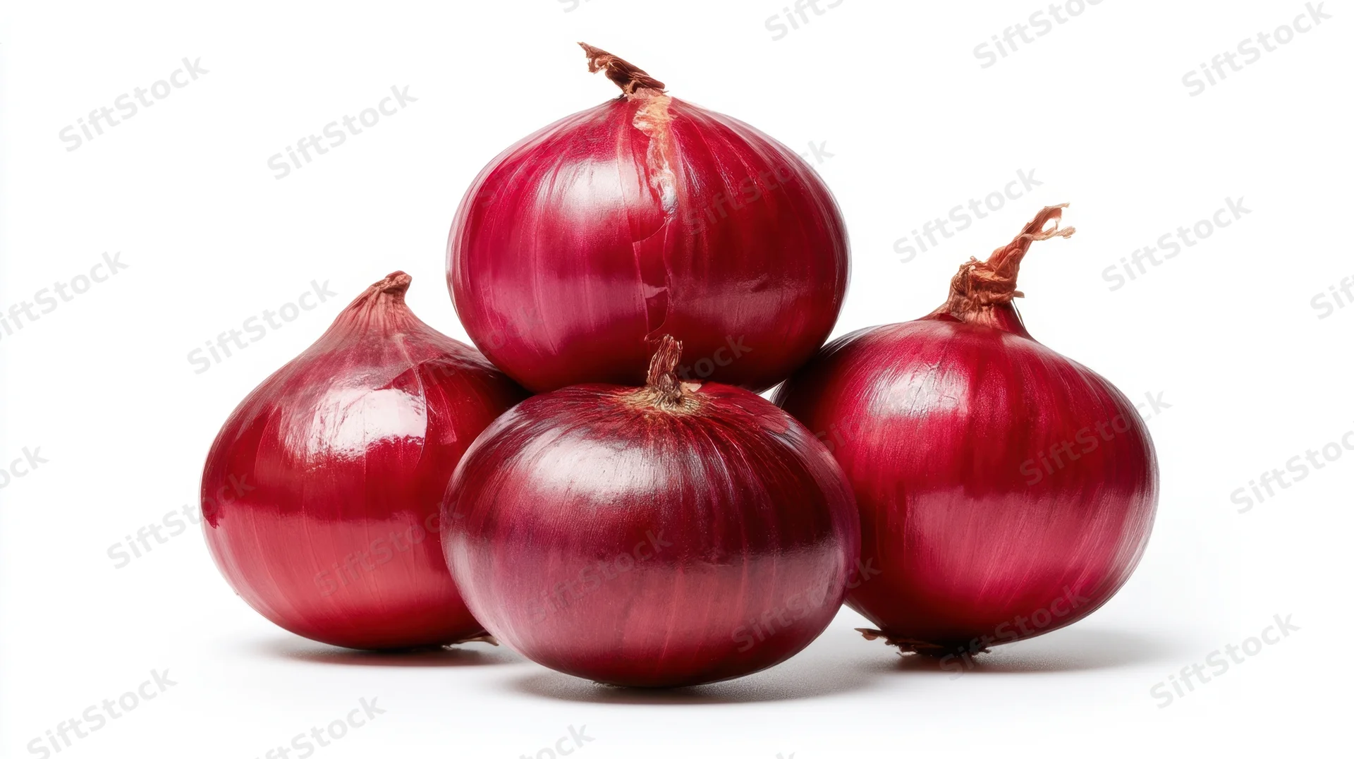 Four red onions arranged in a cluster on a white background