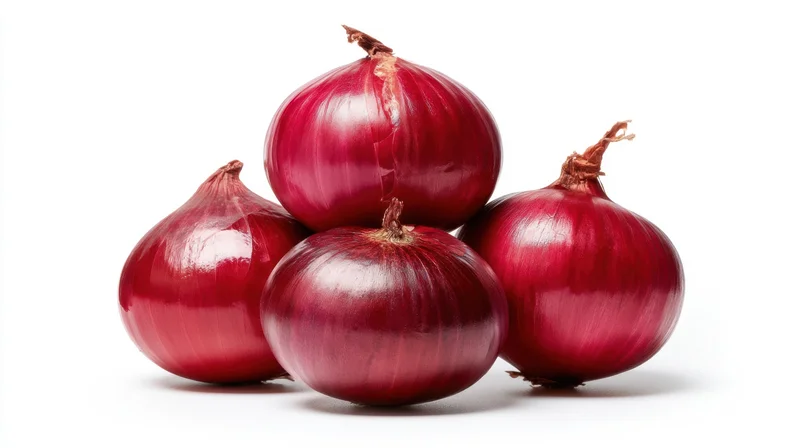 Four red onions arranged in a cluster on a white background