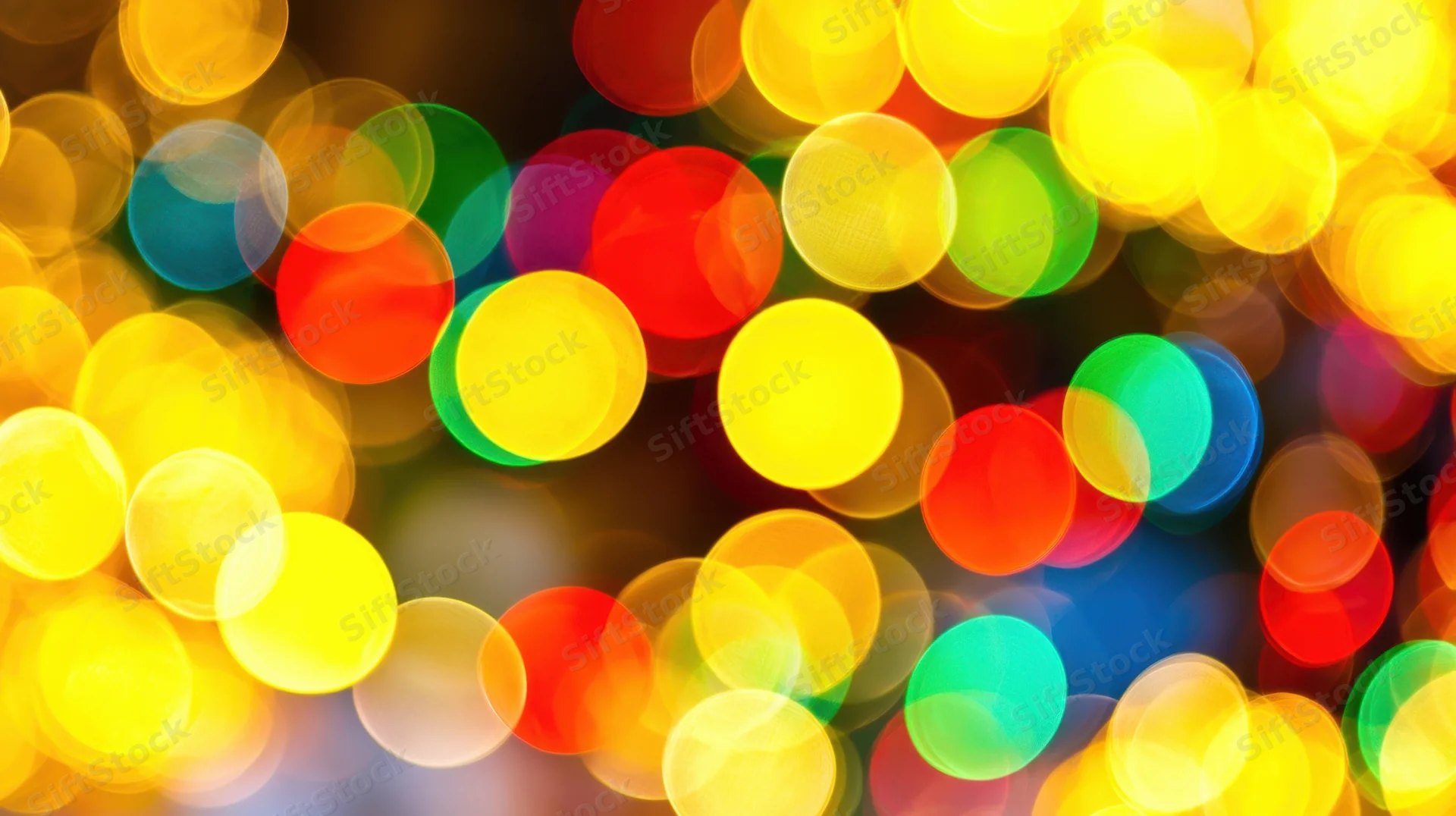 Vibrant colorful bokeh lights in abstract festive background