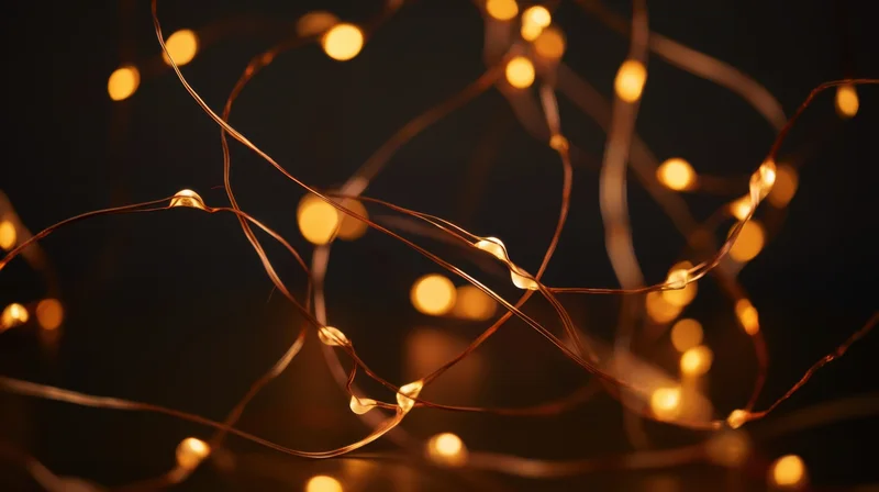 Tangled fairy lights glowing warmly against a dark background